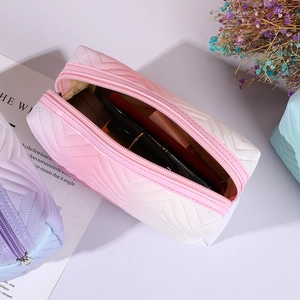 Quilted gradient PU leather makeup bag for travel featuring V-shape stitching and zipper