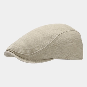 Detail of vintage beige cotton twill beret cap showing high-quality fabric texture