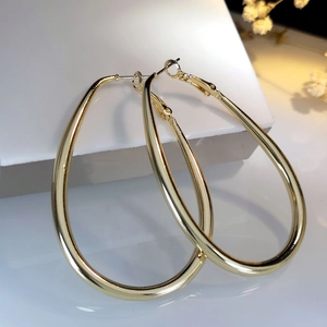 Classic large golden teardrop hoop earrings with a polished finish for a modern stylish look