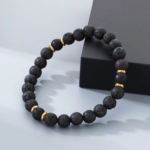 Macro detail of natural black lava rock and matte onyx beaded bracelet for men and women