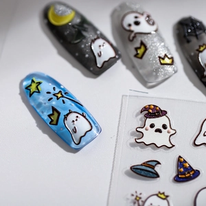 5D Halloween nail stickers featuring cartoon ghosts and stars on blue manicured nails