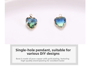 Macro shot of blue-green gradient heart crystal pendant with gold-plated copper frame