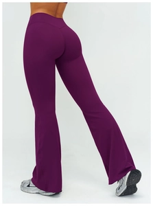 Macro shot of high-waist yoga flare pants showing V-shaped back seam and lift effect