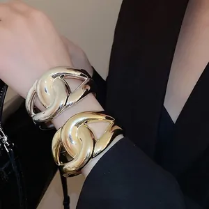 Bold crossover acrylic chunky bangle in gold and silver finish for fashion outfits