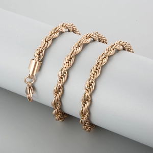 Polished rose gold twisted rope chain bracelet with lobster clasp on display
