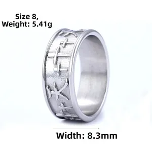 Detail view of 8.3mm wide stainless steel ring with embossed cross and textured matte finish