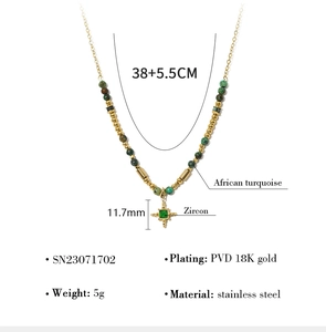 Detail view of gold-plated stainless steel necklace with green stone and turquoise beads