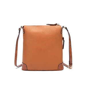 Detailed view of brown pebble grain texture on minimalist crossbody bag with zipper