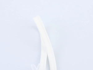 Close-up of white fabric strap showing fine stitching and smooth material detail