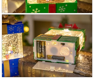 Detailed close-up of the battery compartment for the Christmas music box lantern