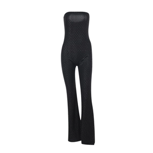 Detail of black tube top jumpsuit with shimmering silver rhinestones and waist design