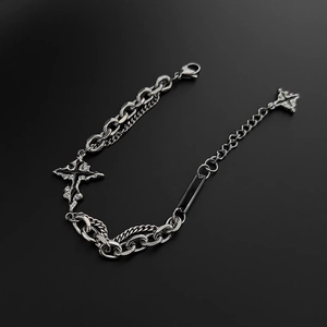 Silver stainless steel punk chain bracelet with cross pendant on black background