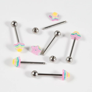 Macro shot of stainless steel tongue bars with colorful rainbow star-shaped tops and balls