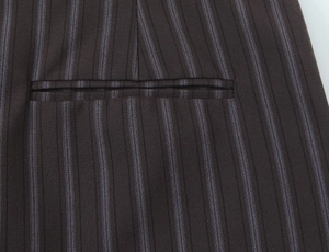 Macro shot of fine pinstripe fabric and precision stitched welt pocket detail