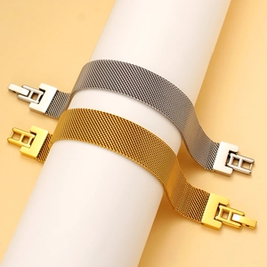 Detail of gold and silver mesh strap bracelets on display with secure folding clasp