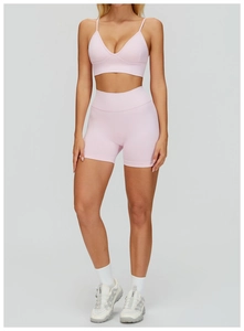 Light pink seamless yoga set featuring a V-neck sports bra and high-waisted shorts