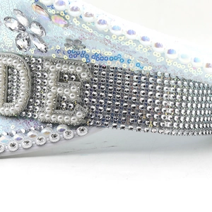 Close-up of luxury white bride captain hat with pearls, sequins and silver rhinestones