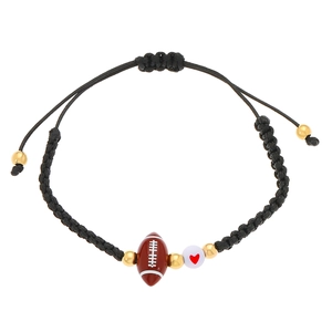 Adjustable woven sports bracelet with brown rugby ball charm and red heart bead