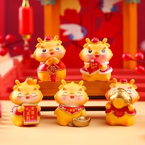 Detailed close-up of 5 festive resin dragon figurines with lucky Chinese characters