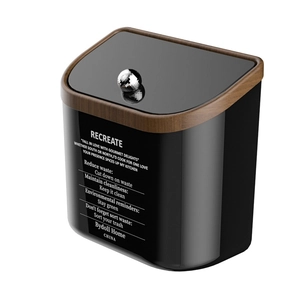 Modern black kitchen trash can with walnut wood grain trim and silver knob handle