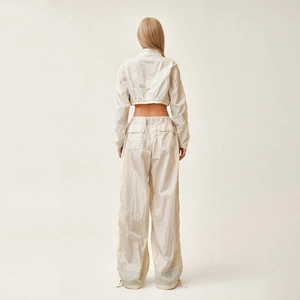 Women's parachute wide-leg pants and cropped long sleeve top set in snow mountain white