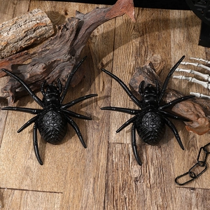 Halloween decorative LED black plastic spiders on a rustic wood background with props