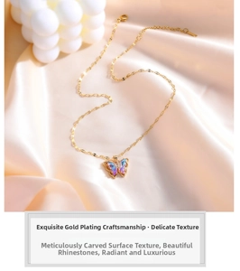 Detail of gold butterfly necklace with blue gradient crystals on pink silk background