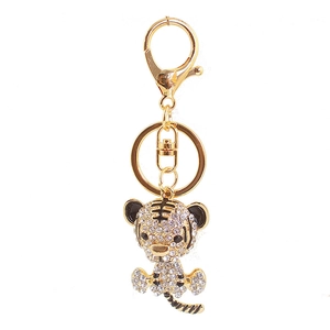 Golden tiger keychain with sparkling crystal rhinestones and lobster clasp on white background