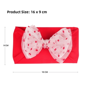 Detailed view of red nylon baby headband with a large white tulle heart bow and size marking