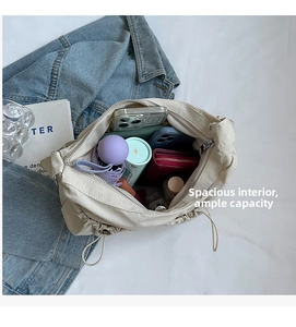Detailed interior of nylon crossbody bag showing large capacity with daily essentials