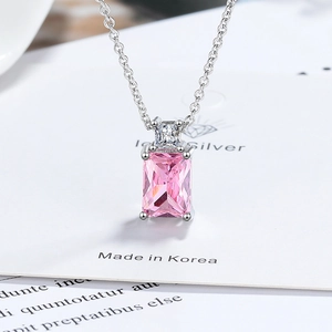Elegant silver necklace with a large rectangular pink zircon pendant and a small clear gem