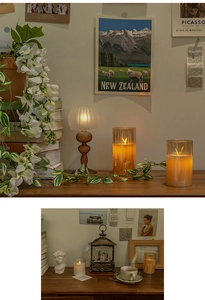 Close-up of amber glass LED candles and vintage lanterns creating a warm home atmosphere