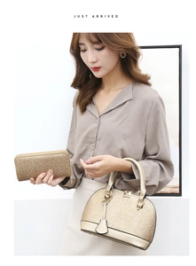 Detail of glitter shell handbag and matching zipper wallet with golden hardware