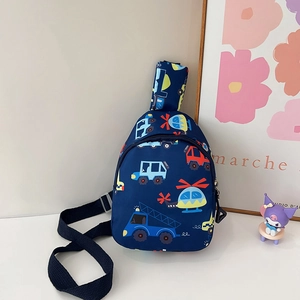 Detail view of children's blue chest bag with cartoon trucks and adjustable strap