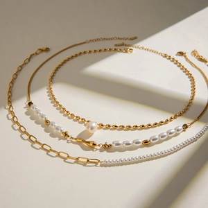 Chic multi-layered stainless steel necklace set with golden chains and white pearls