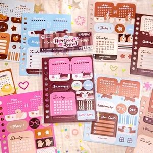 Twelve sheets of colorful heart and cute puppy themed planner stickers with calendar layout