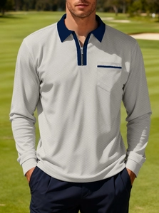 Detail of grey knitted long sleeve polo shirt with navy blue trim and zipper neck