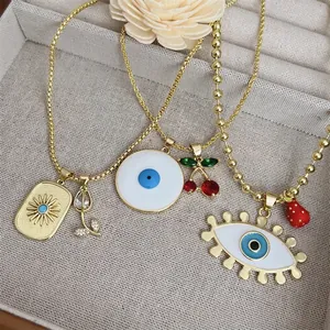 18K gold plated necklace set featuring evil eye, cherry and sunburst pendants with zircon