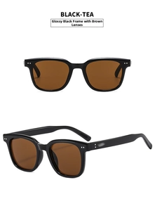 Detail view of glossy black frame sunglasses with tea lenses and metal dot rivets