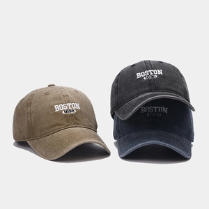 Detail of washed cotton baseball caps with BOSTON 1630 embroidery in various colors
