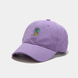 Light purple baseball cap with pineapple embroidery and curved brim in 45-degree view