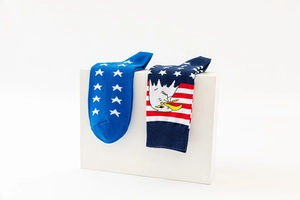 Detailed close-up of American flag socks featuring patriotic stars, stripes, and eagle motifs
