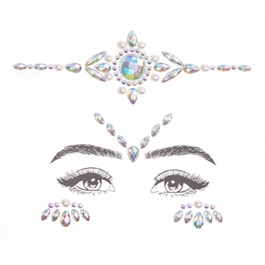 Detailed view of iridescent rhinestones and pearls face jewels for festive makeup
