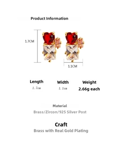 Detail view of heart-shaped red zircon and clear emerald cut crystals earrings