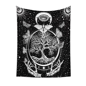 Detail of bohemian black and white tapestry with tree of life and mystic butterfly motifs