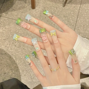 Green and blue gradient press-on nails with 3D bears, pearls, and bows on long square tips