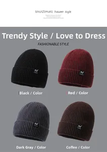Detailed knit texture and logo labels on winter beanie hats in four colors