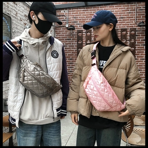 Quilted crossbody waist bags shown in metallic grey and pink on models in a city street setting