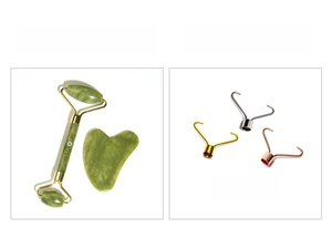 Detail of jade roller and gua sha set with gold, silver and rose gold metal frames