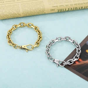 Detail of the large lobster clasp and chunky stainless steel chain in gold and silver